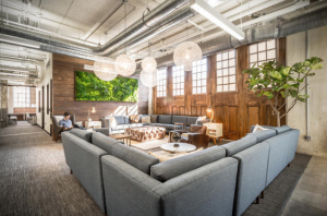 36°N offers a co-working membership, which allows people to come in and co-work anywhere within the space, including in a living room, lounge area, and at tables and chairs spread out in other rooms.