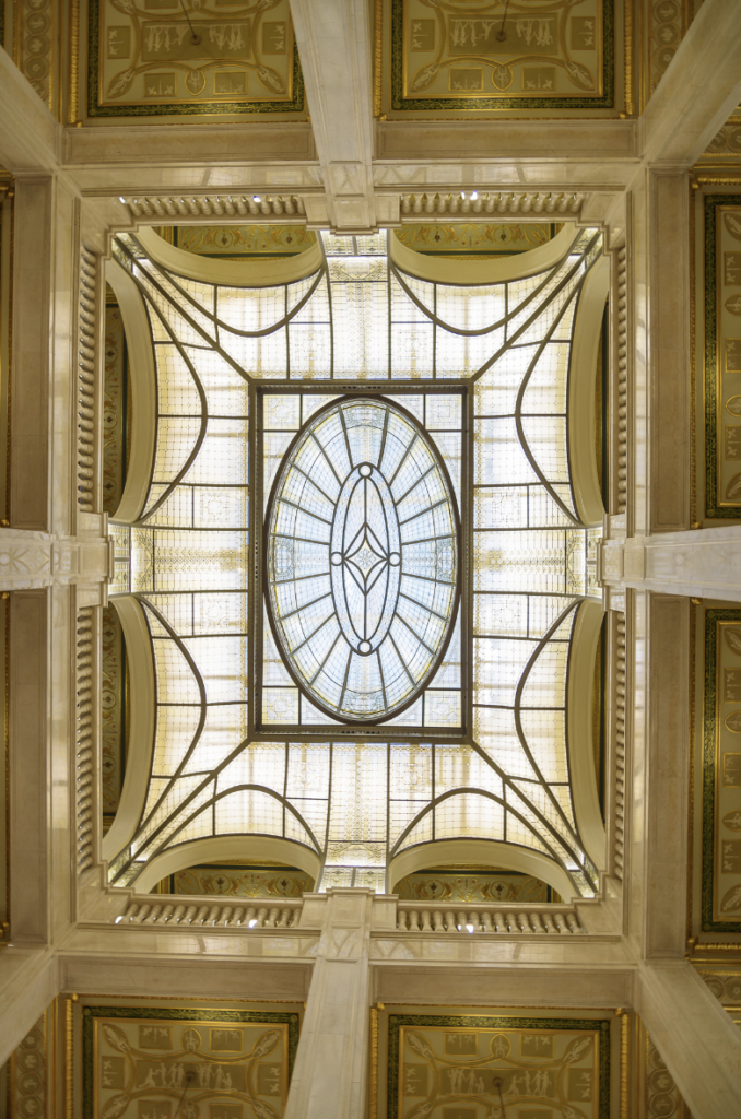 The building’s “crystal ceiling” is one of just a few remaining Keppler Glass Constructions Inc. glass domes left in the world. The ceiling is comprised of more than 6,000 amber and clear glass pieces set within a bronze-grid assembly.
