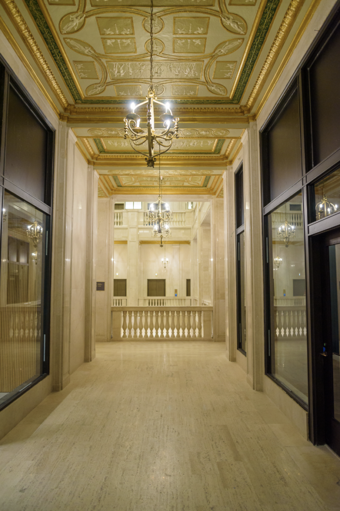 The historic corridor in the commercial portion of the project provides a view of restored plaster ceilings and the atrium balustrade.