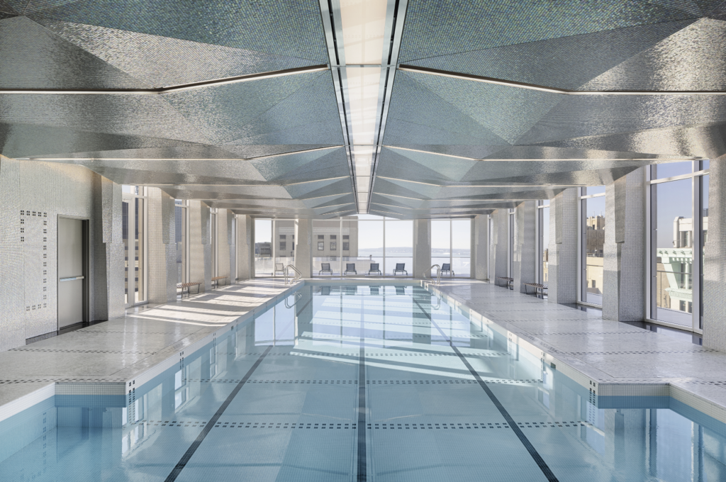 Upstairs, the residents’ 75-foot pool evokes the style and flair of Art Deco pools from the 1930s. An undulating ceiling is covered in individually hand-laid mosaic tile.