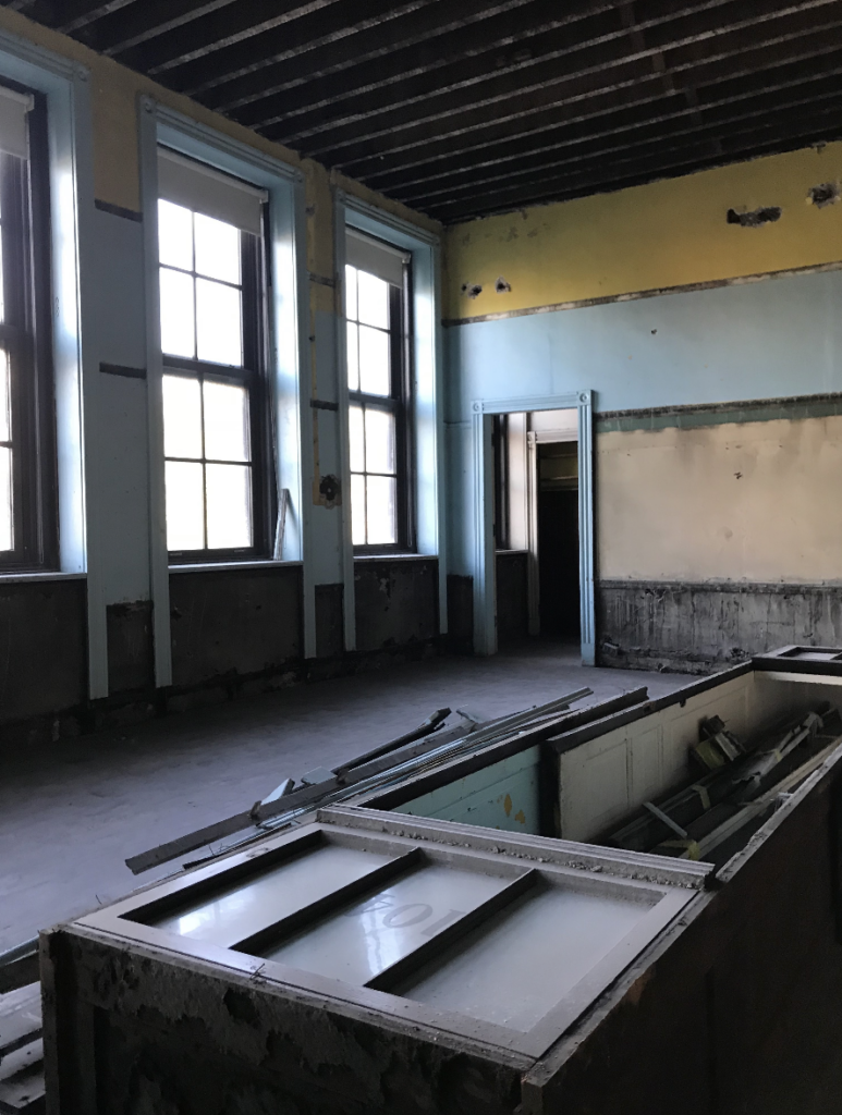 Following the closure of 46 Chicago Public School buildings in 2013, Peabody School was sold through a public auction with a redevelopment plan to transform the historic structure into 23 apartments with a rooftop deck.