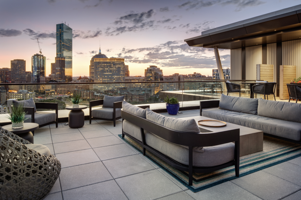 Designed to seamlessly integrate with the interior penthouse clubroom, the rooftop patio conveniently brings the outdoors in and offers residents extended space for entertaining, along with a grilling area, a dog walking space, and epic views. Once a warehouse, now an oasis. 