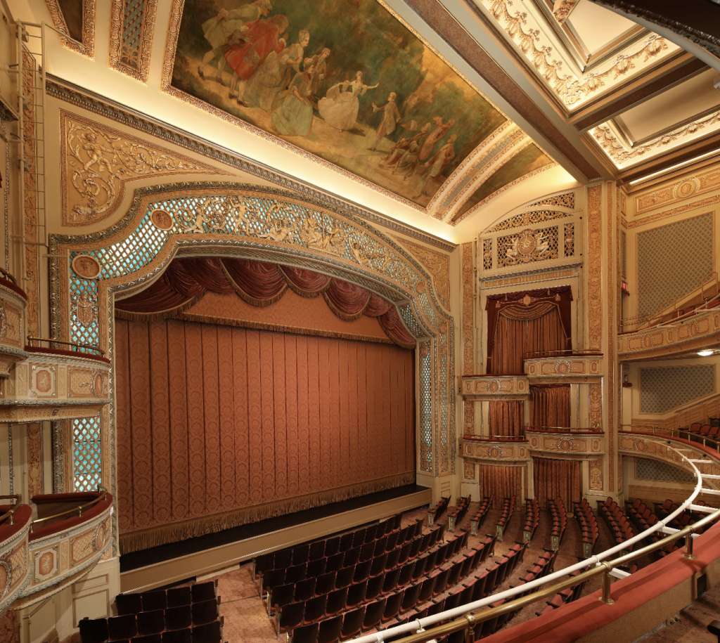 Restored Auditorium with original back-lit proscenium and Marie Antoinette Mural at the soundboard.