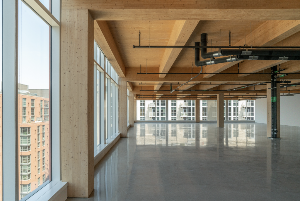 This new office floor features exposed mass timber beams and 16-foot-tall ceilings.
