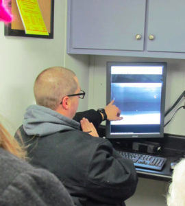 Aaron Drake, radiographer with TÜV Rheinland, studies a digital file of a gun loop exposure. Photo: Fort Pitt Society