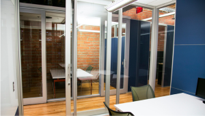 The new Loretta building uses DIRTT glass walls to maintain an open feel throughout the space.