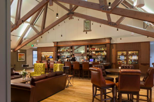 The soaring 35-foot ceiling in The Rookery Bar prominently displays the hayloft’s original 131-year-old wooden trusses.