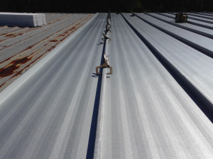 McElroy’s 238T symmetrical standing seam system was installed over the existing roof with the aid of McElroy’s patent-pending 238T Retrofit Clip, a 3 1/2-inch standoff clip that elevates the new roofing system to the top of the existing panels.