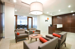 Interior renovations for Pricewaterhouse Coopers’ 10,000-square-foot office suite in Richmond, Va., included framing the reception area with aluminum storefronts and double glass doors that open to ceramic tile floors accented by wood paneling along the walls.