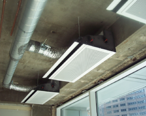 The heat losses along the perimeter were reduced to less than 200 Btuh/lineal foot, which made possible the option of distributing the heat from the ceiling overhead.