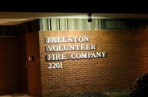 Illuminating the sign on the front of the Fallston Volunteer Fire Company's building, one 150-watt quartz flood light was replaced with a 14-watt LED Small Flood Light.