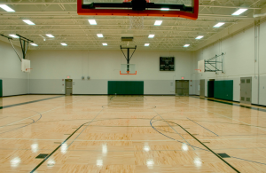 After the district installed GE bulbs, lighting improved so significantly that administrators actually learned that one  of their gymnasiums had a pine floor and white walls, both of which previously appeared yellow due to the amber hue of the previous lighting. 