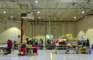 Occupancy sensors switch the fixtures off and on more often in the warehouse, where there are less people working.