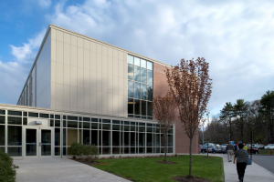 The Metl-Span insulated panels were used to clad the existing brick building with a number of finishes, including smooth, embossed and Tuff-cast, to closely match the finish and color of the precast concrete panels.
