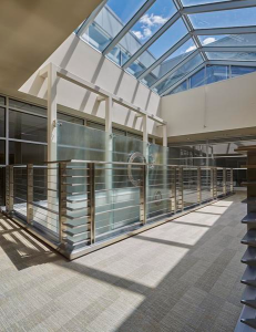 The atrium glazing system reflects the scale and rhythm of the façade, while its railing is an interpretation of the historic railings elsewhere in the building.