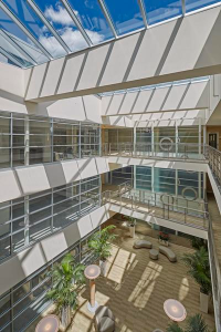 A new full-height atrium brings natural light into the mixed-use building and serves as an elegant lobby and event space.