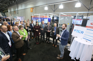PEER program leaders discuss certification and efforts being made to create more resilient, reliable and sustainable power systems in front of an onsite microgrid at Greenbuild 2017. PHOTO: U.S. Green Building Council
